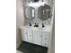Bathroom features a double sink vanity, updated fixtures, and modern design at 7270 W Stone Pass, New Palestine, IN 46163