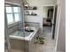 Bright bathroom featuring a bathtub, separate shower with glass door, and views into the main bedroom at 7270 W Stone Pass, New Palestine, IN 46163