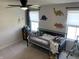 bedroom with dinosaur-themed decorations, including window shades and wall decor around a twin bed at 7270 W Stone Pass, New Palestine, IN 46163