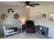 Bedroom featuring a white crib, animal-themed wall decor, and a comfortable chair beside a bookcase at 7270 W Stone Pass, New Palestine, IN 46163
