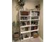 Charming bookshelf filled with books and decor, adding character and storage to the home at 7270 W Stone Pass, New Palestine, IN 46163