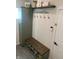 Inviting entryway with a built-in bench, storage, and decorative accents for a warm welcome at 7270 W Stone Pass, New Palestine, IN 46163