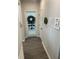 Bright hallway featuring stylish decor and a glass door allowing natural light into the adjacent room at 7270 W Stone Pass, New Palestine, IN 46163