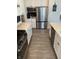 Featuring stainless steel appliances and quartz countertops, this kitchen offers efficient layout and design at 7270 W Stone Pass, New Palestine, IN 46163