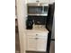 A coffee bar featuring stainless steel appliances and quartz countertops offers efficient layout and design at 7270 W Stone Pass, New Palestine, IN 46163