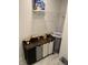 Organized laundry area with shelving, a hanging rack, and a multi-compartment laundry sorter for efficiency at 7270 W Stone Pass, New Palestine, IN 46163