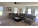 Comfortable living room with plush sectional sofa, carpet, and neutral decor that offers a cozy atmosphere at 7270 W Stone Pass, New Palestine, IN 46163