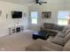 Comfortable living room with plush sectional sofa, carpet, and neutral decor that offers a cozy atmosphere at 7270 W Stone Pass, New Palestine, IN 46163