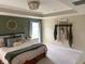 Comfortable main bedroom featuring neutral décor and ample natural light at 7270 W Stone Pass, New Palestine, IN 46163