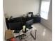 Bright home office space features neutral walls, plush chair, dual monitors and functional storage at 7270 W Stone Pass, New Palestine, IN 46163