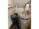 Utility room with water heater, filtration system and modern plumbing at 7270 W Stone Pass, New Palestine, IN 46163
