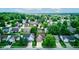 An aerial shot captures a picturesque residential neighborhood with tree-lined streets and well-kept homes in a suburban setting at 741 Chestnut Ln, Brownsburg, IN 46112