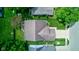 An aerial view showcases the home's roof, landscaping, and surrounding neighborhood, highlighting its prime location at 741 Chestnut Ln, Brownsburg, IN 46112