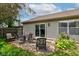 A spacious backyard with a patio set is surrounded by colorful flowers, creating a welcoming and relaxing outdoor space at 741 Chestnut Ln, Brownsburg, IN 46112