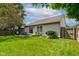 A beautifully maintained backyard features a charming patio, well-manicured lawn, and a secure wooden fence at 741 Chestnut Ln, Brownsburg, IN 46112