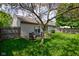 A fenced backyard offers a peaceful retreat with a charming patio area surrounded by lush greenery at 741 Chestnut Ln, Brownsburg, IN 46112
