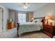 Comfortable bedroom with soft carpet, ceiling fan, and warm lighting at 741 Chestnut Ln, Brownsburg, IN 46112