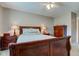 Comfortable bedroom with soft carpet, ceiling fan, and warm lighting at 741 Chestnut Ln, Brownsburg, IN 46112