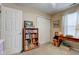 Cozy bedroom featuring a bookcase, a closet, and a wood desk with neutral color scheme at 741 Chestnut Ln, Brownsburg, IN 46112