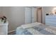 Bedroom featuring a quilt, closet and dresser with neutral paint and carpet at 741 Chestnut Ln, Brownsburg, IN 46112