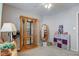 Well-lit guest bedroom showcasing display cabinet and storage at 741 Chestnut Ln, Brownsburg, IN 46112