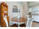 Inviting dining area showcasing wood-look floors, a charming table and decorative kitchen accents at 741 Chestnut Ln, Brownsburg, IN 46112