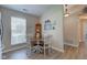 Cozy dining area features wood-look floors, a bright window, and charming decor at 741 Chestnut Ln, Brownsburg, IN 46112