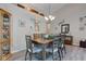 A well-lit dining room with a stylish chandelier and wood-look flooring at 741 Chestnut Ln, Brownsburg, IN 46112