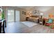Comfortable living room featuring wood-look floors and access to the backyard at 741 Chestnut Ln, Brownsburg, IN 46112