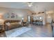 Spacious living room showcasing wood-look floors, a cozy sofa, and inviting decor at 741 Chestnut Ln, Brownsburg, IN 46112