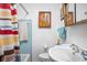Bathroom with a sink, toilet, and shower/tub combination, offering functionality in a compact space at 7651 Sherry Ln, Brownsburg, IN 46112