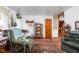 Comfortable living room featuring plush seating, carpet floors, vintage decor, and warm ambient lighting at 7651 Sherry Ln, Brownsburg, IN 46112