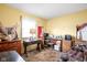 Home office with wood furniture, a desk, and a window, ideal for a quiet workspace at 7651 Sherry Ln, Brownsburg, IN 46112