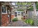 Cozy brick patio with pergola, offering a private outdoor space for relaxation and entertaining at 7651 Sherry Ln, Brownsburg, IN 46112