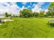Backyard featuring lush lawn and neighborhood houses at 7710 Samuel Dr, Indianapolis, IN 46259