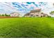 Large backyard featuring a sprawling green lawn, ideal for Gathering gatherings and outdoor enjoyment at 7710 Samuel Dr, Indianapolis, IN 46259
