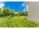A spacious backyard with lush green grass and mature trees at 7710 Samuel Dr, Indianapolis, IN 46259