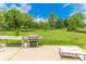 Backyard with large grass area, grill, and a side table at 7710 Samuel Dr, Indianapolis, IN 46259