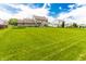 Expansive backyard featuring a well-manicured lawn perfect for outdoor activities and relaxation at 7710 Samuel Dr, Indianapolis, IN 46259