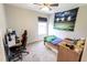 Bedroom space including an athletic decor theme, desk, and gaming setup at 7710 Samuel Dr, Indianapolis, IN 46259