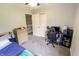 Bedroom featuring a gaming setup, dresser, and light-colored walls at 7710 Samuel Dr, Indianapolis, IN 46259