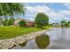 Backyard view of home, deck and pond at 7911 Bentley Commons Dr, Indianapolis, IN 46259