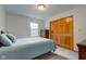 Bright bedroom with double closet, window and dresser at 7911 Bentley Commons Dr, Indianapolis, IN 46259