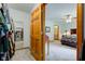 View from walk-in closet into a bedroom with bed and en suite bathroom at 7911 Bentley Commons Dr, Indianapolis, IN 46259