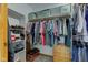 Walk-in closet with clothing racks, shelving, and wooden drawers at 7911 Bentley Commons Dr, Indianapolis, IN 46259