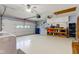 Spacious two car garage with work bench and tool storage at 7911 Bentley Commons Dr, Indianapolis, IN 46259