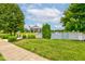 Picturesque gazebo by the lake with manicured lawn, providing a serene community gathering space at 7911 Bentley Commons Dr, Indianapolis, IN 46259