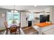 Bright eat-in kitchen with white cabinets, modern appliances, and hardwood style floors at 8025 Meadow Ln, Indianapolis, IN 46227