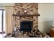 Close-up of a brick fireplace with mantel at 8061 Sycamore Springs Trl, Indianapolis, IN 46239