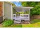 The home features a cozy covered back porch, perfect for outdoor relaxation at 8178 Foxchase Cir, Indianapolis, IN 46256
